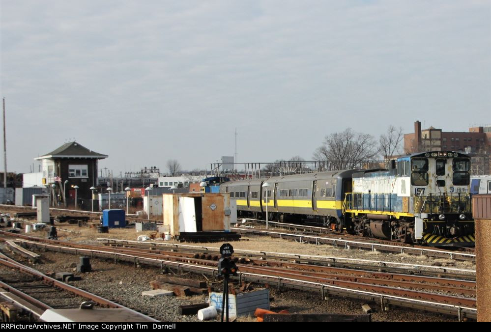 LI 157 on laser train passing Jay tower